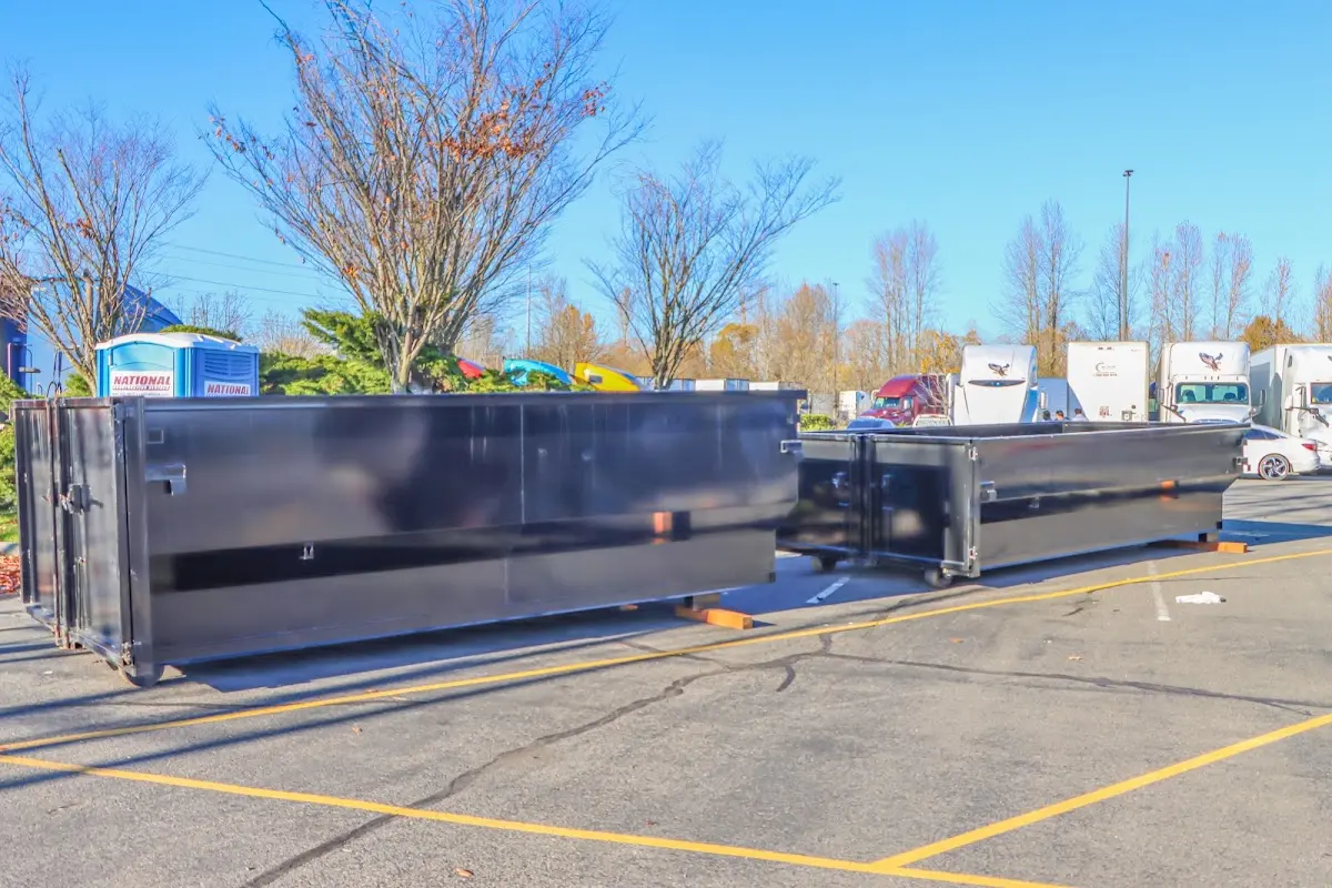 Professional dumpster rental service with roll-off container on residential driveway in Union Hill-Novelty Hill